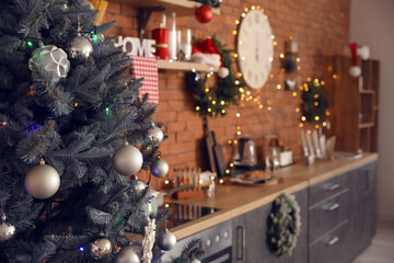 Beautiful Christmas tree in interior of kitchen