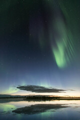 Northern lights reflected in the water