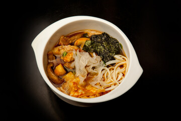 Japanese soup with chicken, mushrooms and noodles