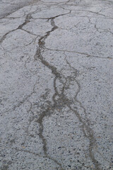 cracks on the asphalt on the road cracked coating