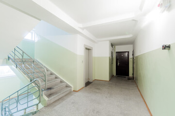 Russia, Moscow- April 17, 2020: interior public place, house entrance. doors, walls, staircase corridors, stairs, steps