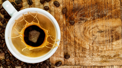 coffee expresso with coffee splash in mug, freeze motion.