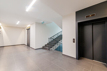 Russia, Moscow- April 17, 2020: interior public place, house entrance. doors, walls, staircase...