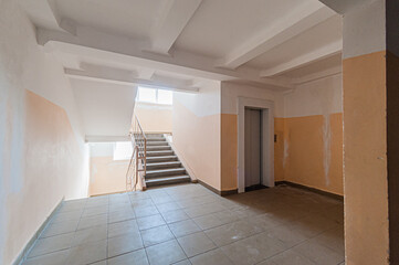 Russia, Moscow- April 17, 2020: interior public place, house entrance. doors, walls, staircase corridors, stairs, steps