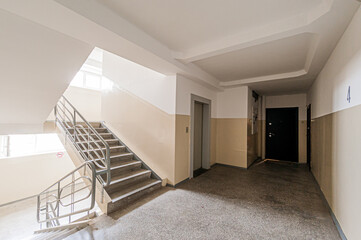 Russia, Moscow- April 17, 2020: interior public place, house entrance. doors, walls, staircase corridors, stairs, steps
