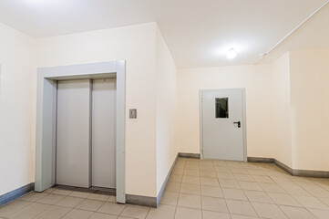 Russia, Moscow- April 17, 2020: interior public place, house entrance. doors, walls, staircase corridors