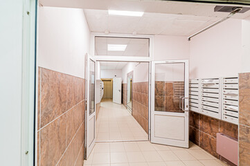 Russia, Moscow- April 17, 2020: interior public place, house entrance. doors, walls, staircase corridors