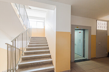Russia, Moscow- April 17, 2020: interior public place, house entrance. doors, walls, staircase corridors, stairs, steps