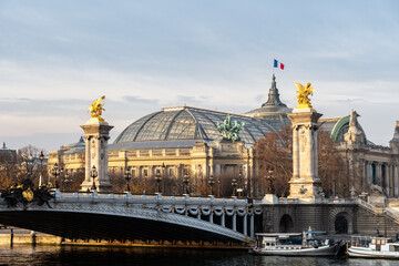 Alexandre III bridge and Grand Palais at golden hour in Autumn - Paris, France