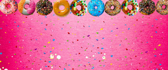 colorful donut with sprinkle on pink background. Background image with copy space