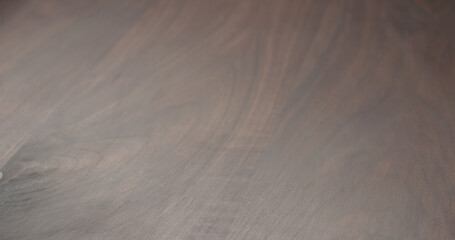 background of dark toned black walnut surface