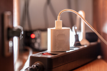 The adapter is plugged into a power outlet.