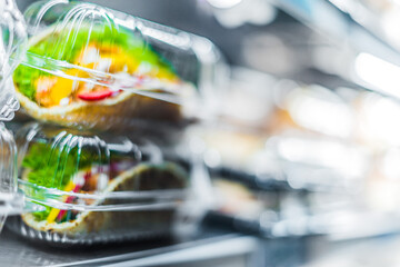 Chicken with pita sandwiches in a commercial refrigerator