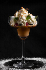 cup with Crem covered caramel in glasses with berries and blue berries