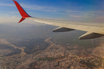 View from airplane window on the airplane wing. Flying and traveling concept
