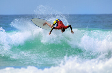 Surfer in progressed on the wave