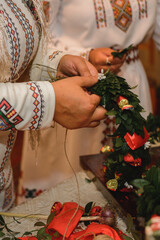 Fototapeta premium Wedding traditions in Ukraine, periwinkle wreath for the bride on her wedding day from her parents.
