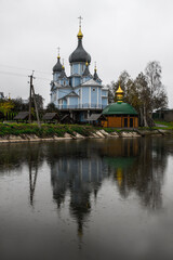 The wooden church is shot from the lower angle against the sky.