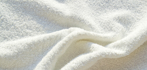 White Terry bath towel, texture with pleats, background
