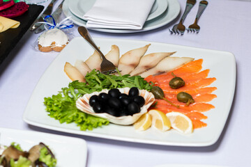 Table setting, food and decorations for important and family events, delicious snacks and hot dishes.