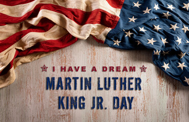 Fototapeta na wymiar Happy Martin Luther King Day concept. American flag againt old wooden background