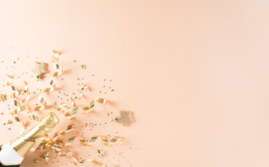 Happy New year celebration background concept. Champagne with stars and christmas ball on pastel...
