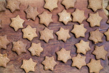 Baking gingerbread cookies with traditional gingerbread dough for Christmas time