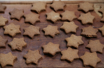 Baking gingerbread cookies with traditional gingerbread dough for Christmas time
