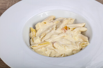 Italian pasta penne with cheese