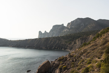 Scenic view of bay and on a rock like a unicorn from mountain path. The Golitsyn trail, Crimea. Rocky coast of the black sea.