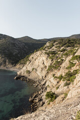 Fototapeta na wymiar Scenic view of bay with clear blue water from mountain path. The Golitsyn trail, Crimea. Rocky coast of the black sea. Seascape.