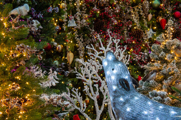 Christmas installations and decorations with garlands, trees, pine needles and illumination. 05 December 2020, Minsk, Belarus