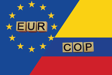 United Europe and Colombia currencies codes on national flags background