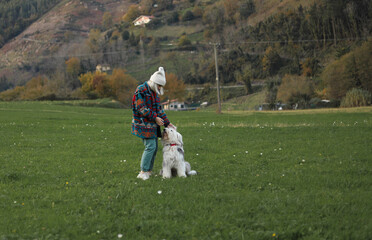 
Woman playing with her dog in the field