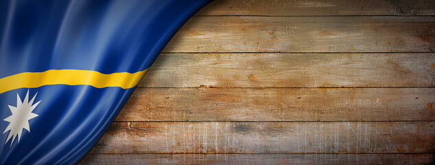 Nauru flag on vintage wood wall banner