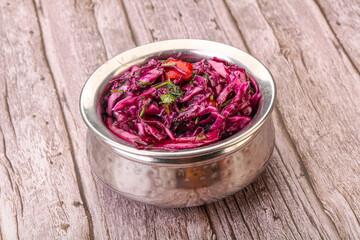Obraz na płótnie Canvas Pickled red cabbage with herbs