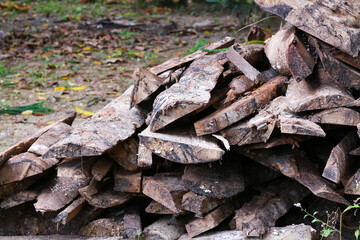 A pile of friewood, wood carcass on the ground
