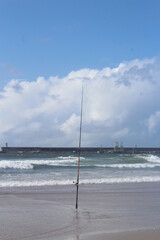 Fishing rod standing on the beach - Fishing pole