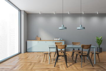 Grey and wooden dining room with wooden minimalist furniture on parquet