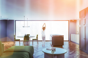 Woman in wooden living room interior