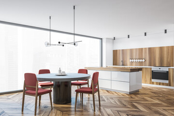White and wooden kitchen corner with table