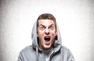 Yelling young man in hoodie