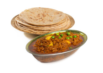 Rajasthani Famous Traditional Cuisine Haldi Sabji or Tukkar Served with Salad on White Background