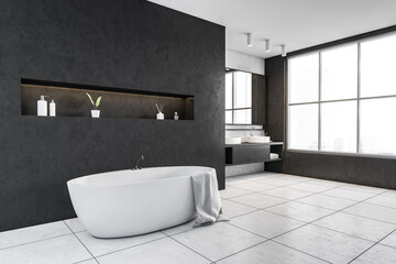 Grey and white bathroom with white bathtub, mirror and big window