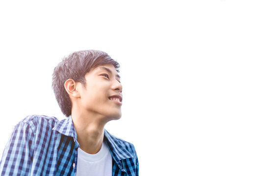 Handsome asian pre teen boy smile.Happy asian boy looking up to sky and smile.Asian preteen tween teen boy student relaxing thinking in future.Handsome asian man.High school teenager.positive people.