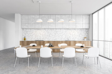 White and wooden dining room in the kitchen near window with chairs and table