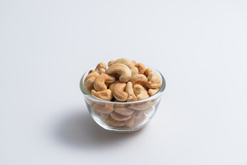 Cashew nut in container with white background - 397595020