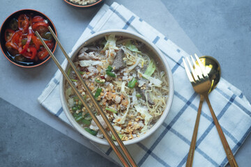 Thai egg noodle soup with many fresh vegetable and many topping