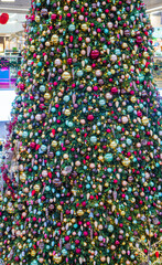 Christmas fir tree with decorations and toys for background