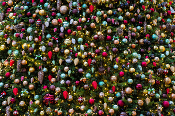 Christmas fir tree with decorations and toys for background